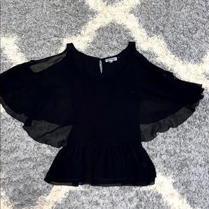 Cold shoulder top. Cinched at the waist.